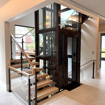 Project #136 | Modern Floating Staircase Encircling Glass Elevator