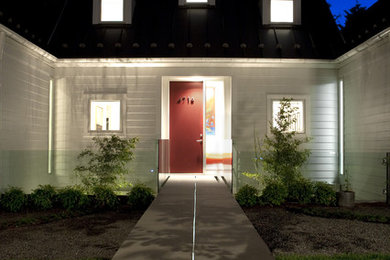 Large transitional white one-story house exterior idea in DC Metro with a metal roof