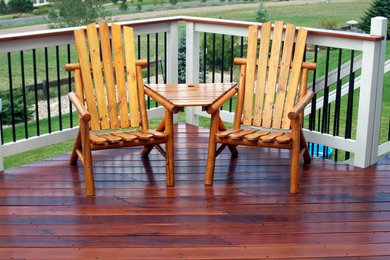 Mid-sized backyard outdoor kitchen deck photo in Denver with no cover