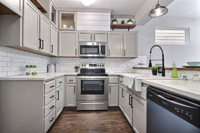 Inspiration for a small eclectic u-shaped laminate floor and brown floor kitchen remodel in Seattle with a farmhouse sink, beige cabinets, concrete countertops, white backsplash and subway tile backsplash
