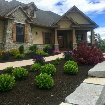 New Home- granite wall, paver walkway, and plantings