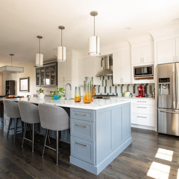 White Kitchen with Large Gray Center Island, Dramatic Pendant Lights