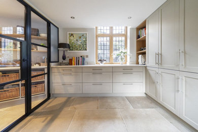 Inspiration for a medium sized traditional cream and black l-shaped kitchen pantry in Other with shaker cabinets, beige cabinets, quartz worktops, no island, white worktops, a submerged sink, ceramic flooring and beige floors.