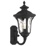 Livex Lighting - Textured Black Traditional, Victorian, Sculptural, Outdoor Wall Lantern - From the Oxford outdoor lantern collection, this traditional cast aluminum upward facing single-light medium wall lantern design will add curb appeal to any home. It features a handsome, antique-style wall plate and decorative arm. Clear water glass casts an appealing light and lends to its vintage charm. The wall plate, arm and other details are all in a textured black finish. With superb craftsmanship and affordable price, this fixture is sure to tastefully indulge your senses.