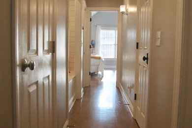 Mid-sized country dark wood floor and brown floor hallway photo in Charlotte with gray walls