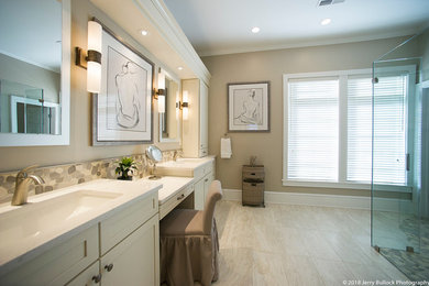 Walk-in shower - large transitional master beige tile and porcelain tile porcelain tile and beige floor walk-in shower idea in DC Metro with shaker cabinets, beige cabinets, a two-piece toilet, beige walls, an undermount sink, quartz countertops, white countertops and a hinged shower door