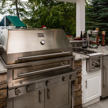 Luxurious White Outdoor Kitchen - Accented by Stone