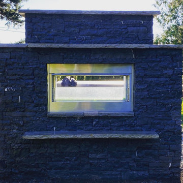 Outdoor kitchen and pass through gas fireplace