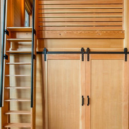 Barn doors closed on the queen size bedroom with sleeping loft above. - Products