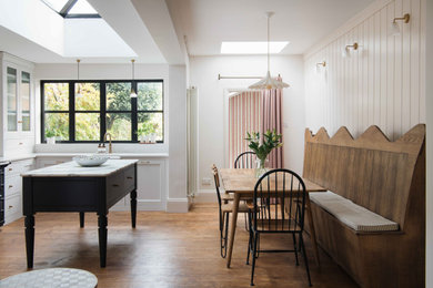 Photo of a medium sized victorian kitchen/dining room in Other with dark hardwood flooring.