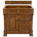 James Martin Vanities - Brookfield 36" Country Oak Single Vanity - The Brookfield 36" Country Oak vanity by James Martin Vanities features hand carved accenting filigrees and raised panel doors. One door opens to shelves for storage below and two drawers, made up of a lower double-height drawer and a middle standard drawer, offer additional storage space. The look is completed with Antique Brass finish door and drawer pulls. Matching decorative wood backsplash is included.