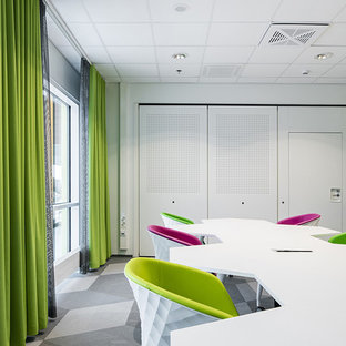 Design ideas for a medium sized modern home office and library in Other with a reading nook, white walls, lino flooring, a freestanding desk and grey floors.