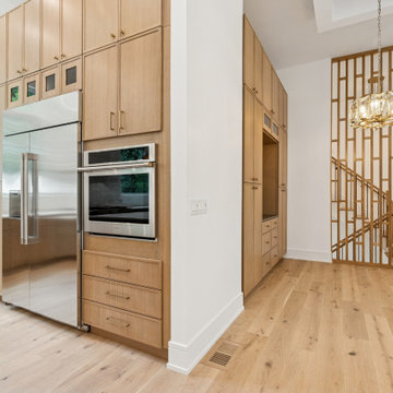 Elevated Kitchen Wall with Hidden Storage & Sculptural Divider