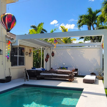 Retractable Pergola with Motorized Screens on Poolside Patio