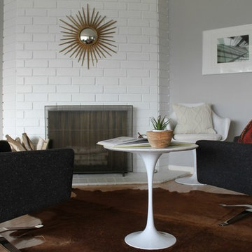 Starburst Mirror on White Painted Mid Century Modern Fireplace