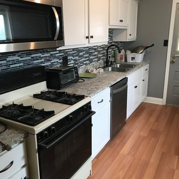 kitchen remodel------new white cabinets countertops and backsplash