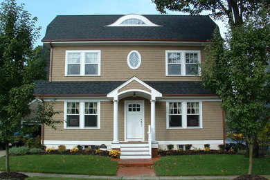 Large elegant beige three-story wood exterior home photo in New York