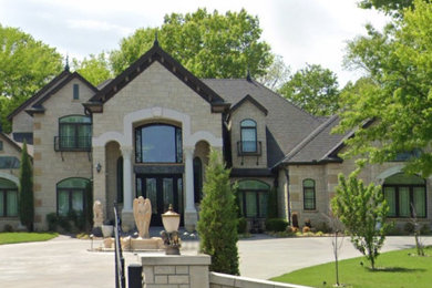 Example of a french country exterior home design