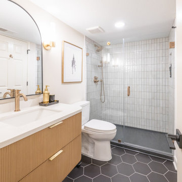 Warm & Inviting Basement Retreat with Custom Bar + Entertainment Center