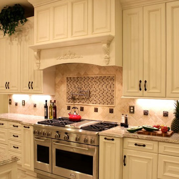 Luxurious Kitchen w/Antique White Cabinetry & Custom Wood Range Hood
