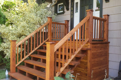 Mid-sized wood railing front porch idea in Vancouver