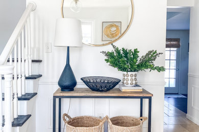 Entryway - coastal travertine floor entryway idea in Detroit with white walls