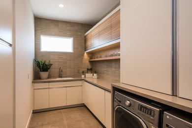 Trendy laundry room photo in Phoenix