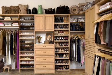 Large gender-neutral carpeted walk-in closet photo in San Francisco with recessed-panel cabinets and light wood cabinets