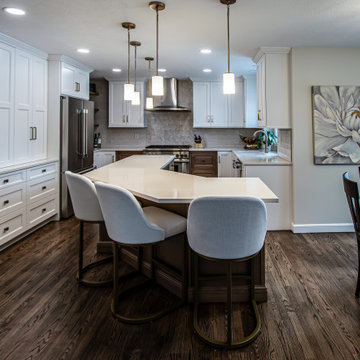Two Tone Kitchen with Floating Shelves and Island Seating and Updated Fireplace