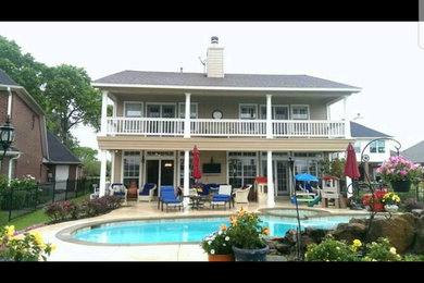 Example of a country exterior home design in Houston