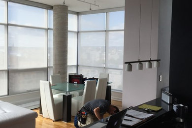 Small trendy light wood floor and beige floor great room photo in Ottawa with white walls and no fireplace