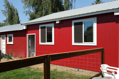 Example of a country exterior home design in Other