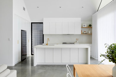 This is an example of a contemporary kitchen in Perth with concrete floors and vaulted.