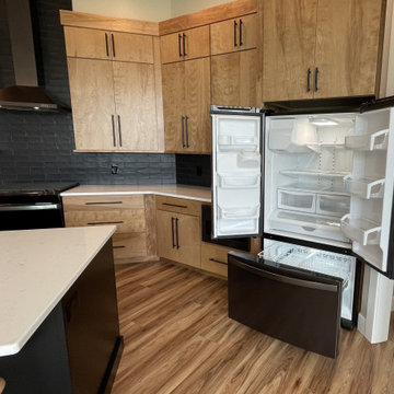 Angled Kitchen Design with Slab Style Cabinets in Pecan Stain