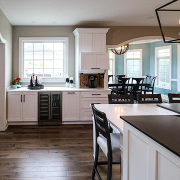 White Transitional Kitchen with Black Hardware and Glass Tile Backsplash