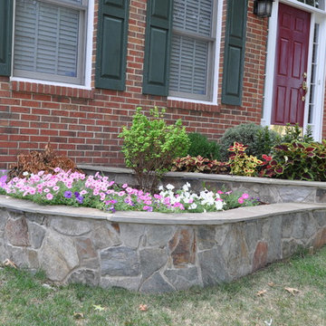 Flagstone with brick border walkway and garden walls