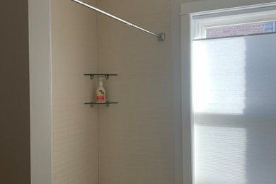 Bathroom - modern beige tile and ceramic tile bathroom idea in Chicago