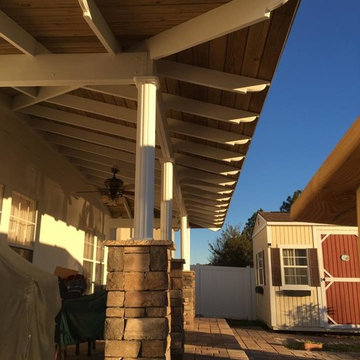 Outdoor Bar with Exposed Rafter Roofing & Paver Seating