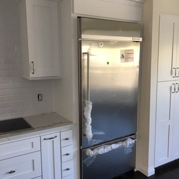 kitchen White shaker cabinets with Calacatta Gold quartz countertops