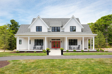 Large farmhouse white two-story vinyl and clapboard exterior home photo in Boston with a shingle roof and a gray roof