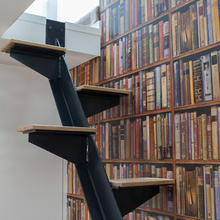 Photo of a small modern wood floating staircase in Sydney with metal risers.
