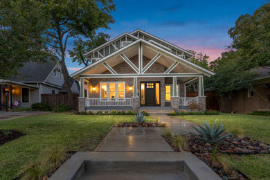 Inspiration for a large craftsman multicolored two-story mixed siding and board and batten exterior home remodel in Dallas with a shingle roof and a gray roof