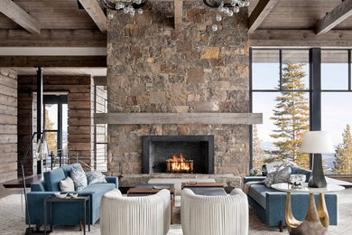 Mountain style open concept vaulted ceiling and dark wood floor living room photo in Other with a standard fireplace, a stone fireplace and no tv