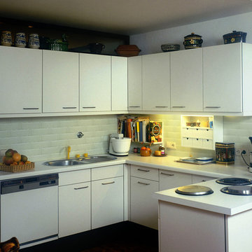 Quaint Kitchen with White Glass Tile