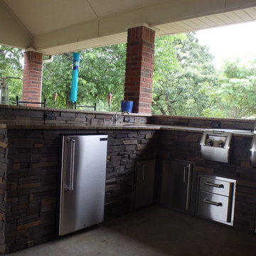 L Shaped Outdoor Kitchen With Unique Lighting