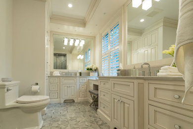 Large trendy master ceramic tile terra-cotta tile, turquoise floor and double-sink bathroom photo in Baltimore with raised-panel cabinets, beige cabinets, a one-piece toilet, white walls, an undermount sink, quartz countertops, a hinged shower door, gray countertops, a niche and a freestanding vanity