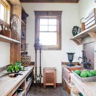 This is an example of a medium sized rustic garden shed in Milwaukee.