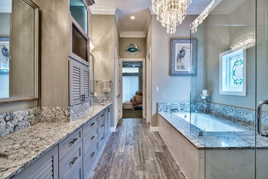 Large cottage chic master gray tile and porcelain tile porcelain tile doorless shower photo in Miami with louvered cabinets, gray cabinets, an undermount tub, gray walls, an undermount sink and quartz countertops