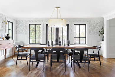 Enclosed dining room - farmhouse medium tone wood floor enclosed dining room idea in Portland with multicolored walls and no fireplace