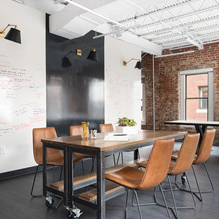 Large urban study in Boston with multi-coloured walls, dark hardwood flooring, no fireplace and black floors.